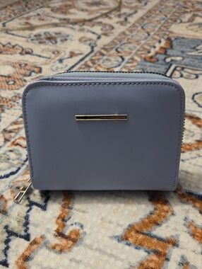 Compact Light Blue Zip Wallet with Polished Metal Accent